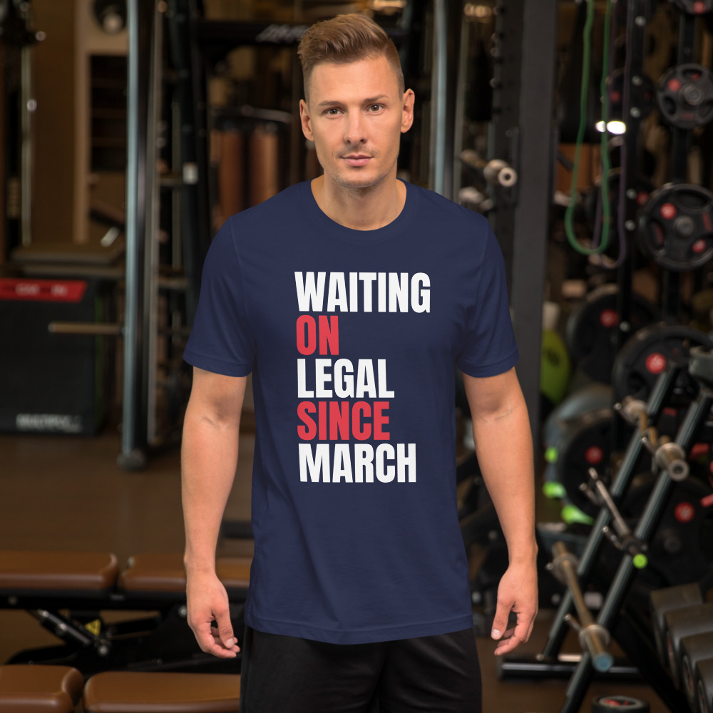 WAITING ON LEGAL SINCE MARCH — printed on a navy t-shirt