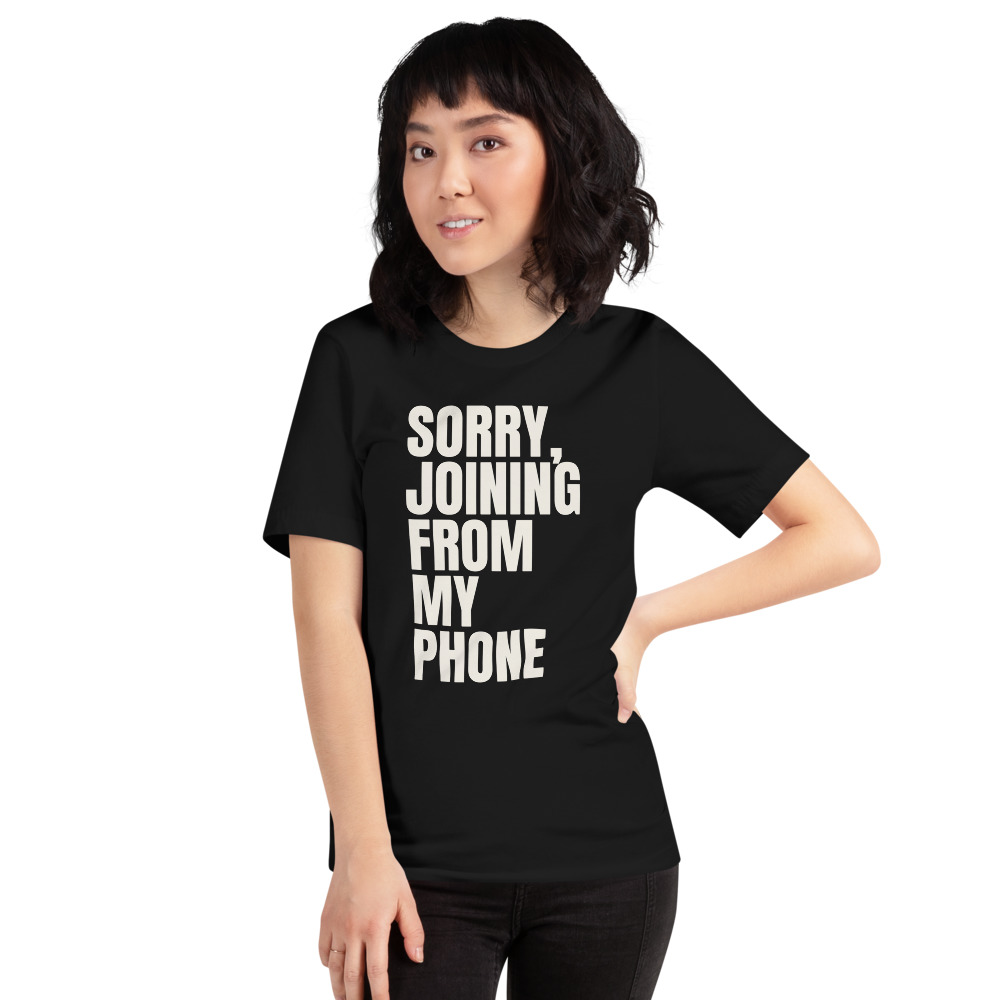 SORRY, JOINING FROM MY PHONE — printed on a black t-shirt