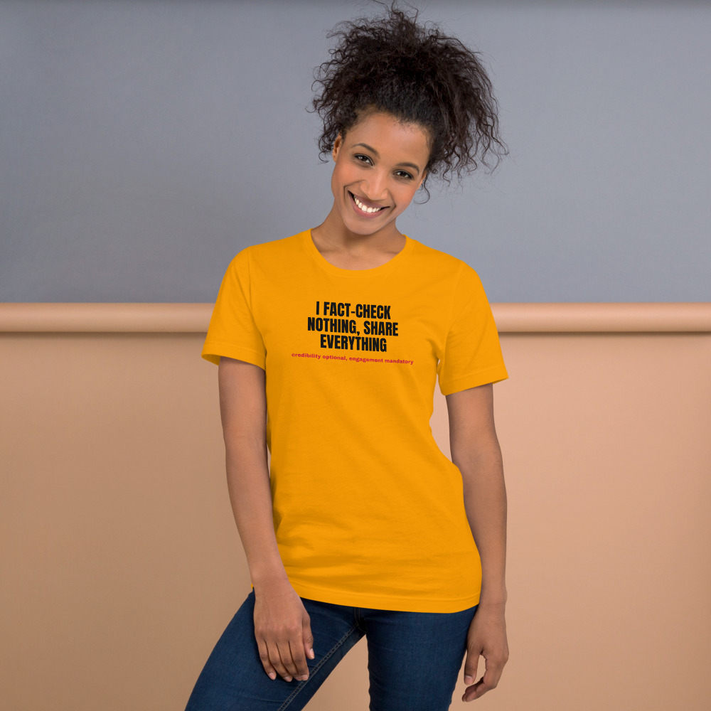 I FACT-CHECK NOTHING, SHARE EVERYTHING — printed on a gold t-shirt