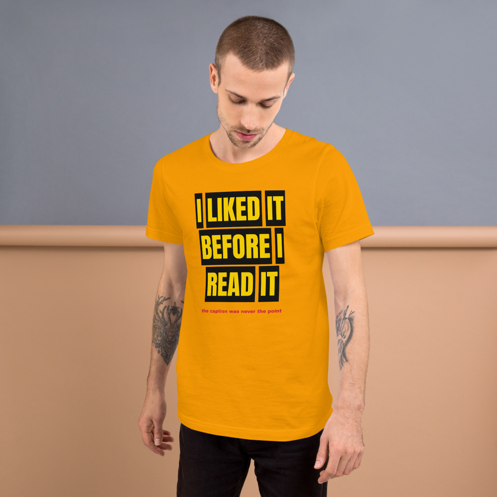 I LIKED IT BEFORE I READ IT — printed on a gold t-shirt