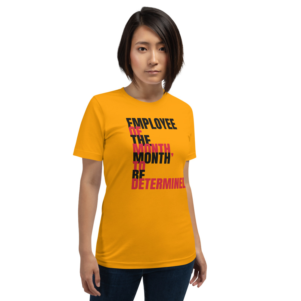 EMPLOYEE OF THE MONTH, MONTH TO BE DETERMINED — printed on a gold t-shirt